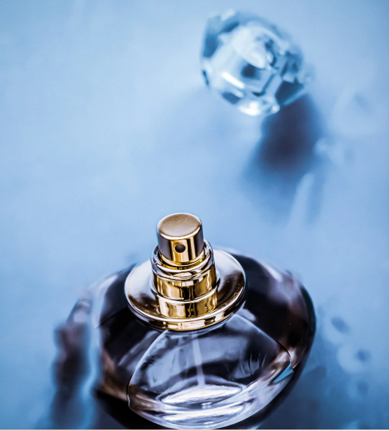 Caramel Sage luxury perfume bottle with fresh blue background by Fragmend